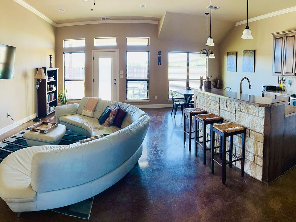 Living dining and kitchen open floor plan with lots of natural light