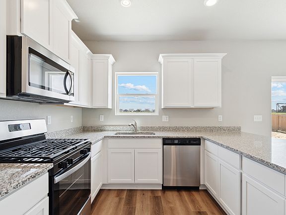 The kitchen of the Laramie has sprawling granite countertops.