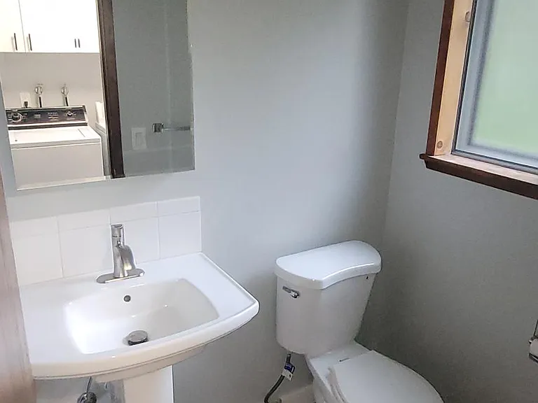 Second small bathroom adjacent to laundryroom