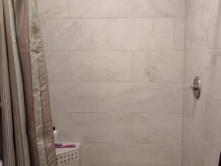 Large oversize shower with all tile finish best water pressure for great relaxing showers.