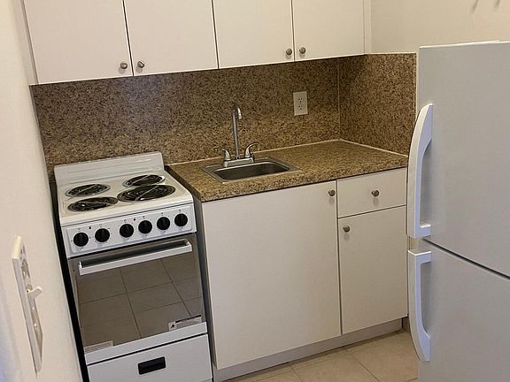 Quaint kitchen with new appliances