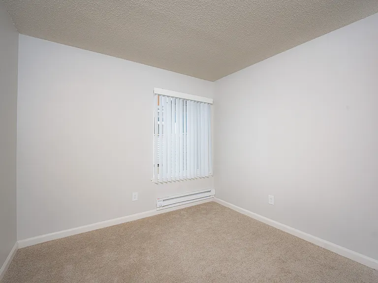 Transform this bright, empty space into your dream room, offering endless customization opportunities.