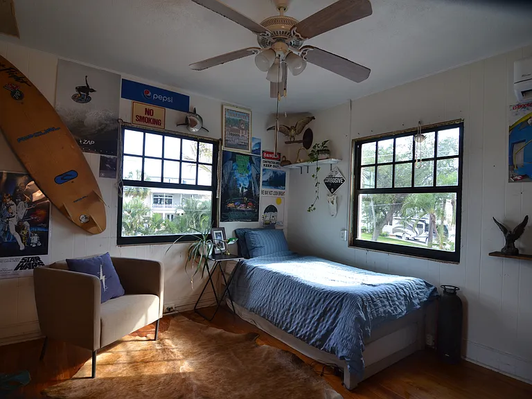 Upstairs beach town twin bedroom. Second twin bed stored under bed.
