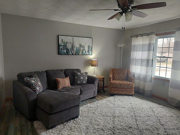 Comfy living room with newer luxury vinyl plank floors throughout entire home (except full bath).

Home is currently unfurnished; pictures show home staged.