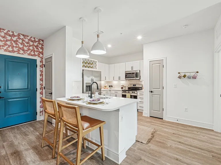 Kitchen with Quartz Countertop and Stainless Steel Appliances.
