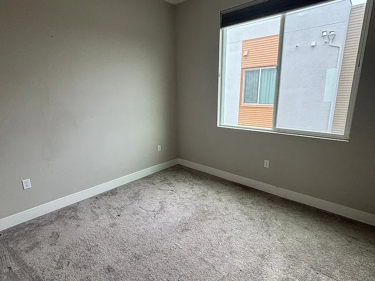 Bedroom #2 on third floor with connected full bath/tub and walk in-closet.
