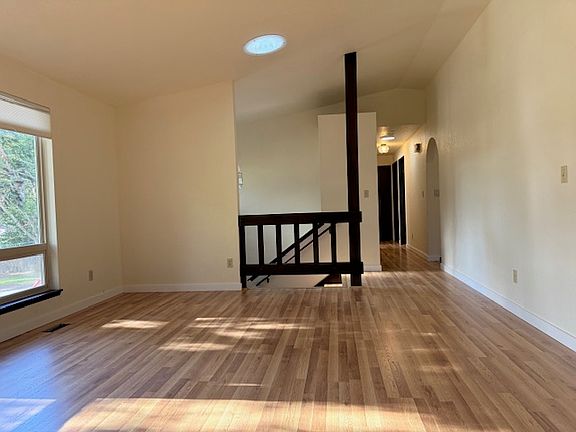 view of living room facing hallway to bedrooms Shows solatube letting in sunlight