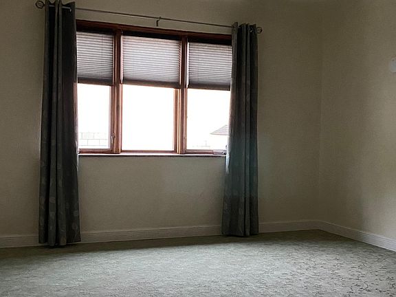Living room (approximately 12X18). East facing windows with pull down cellular shades.