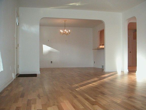 Large dining room with pass-thru bar to kitchen adds to the open, connected feeling.