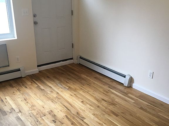 bedroom with access to back yard and patio.