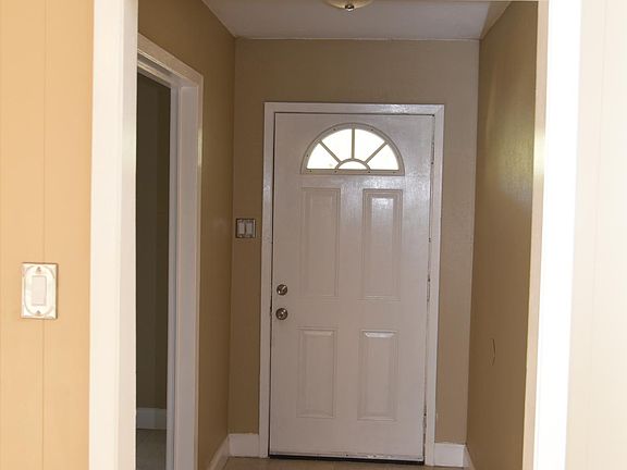 FRONT ENTRANCE - HOUSE IS TILED THROUGHOUT