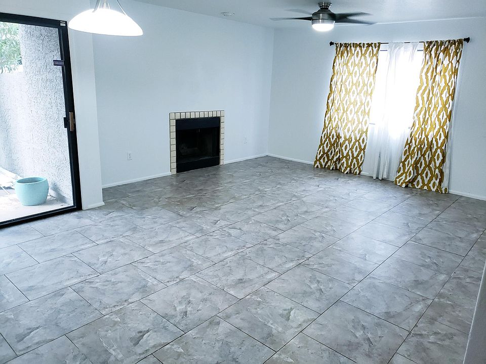 Spacious common room w/ Fireplace. Tile throughout unit.
