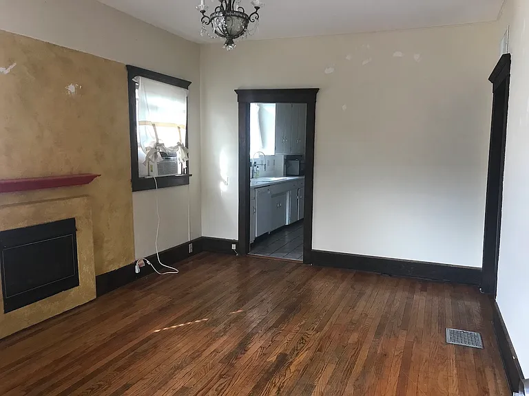 Living room, looking into kitchen, hallway to the right