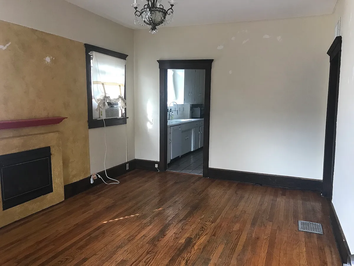 Living room, looking into kitchen, hallway to the right - N 1st Ave