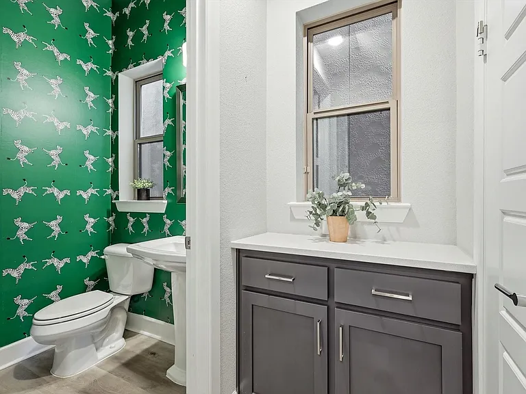 Powder room and coffee bar located just off the kitchen. Large closet to the right.