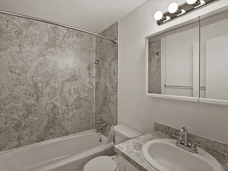 Modern bathroom with elegant finishes and practical storage. Modern bathroom with elegant finishes and practical storage.