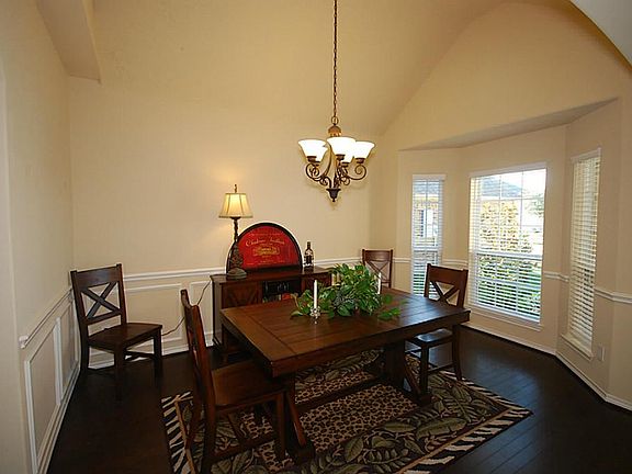 Very open dining room with nice wood floors.