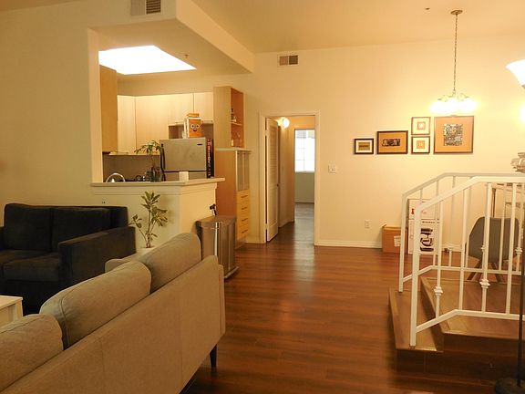 View of unit looking towards kitchen and dining area.