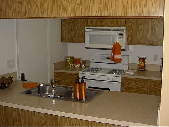 Kitchen with breakfast bar. Mounted microwave included
