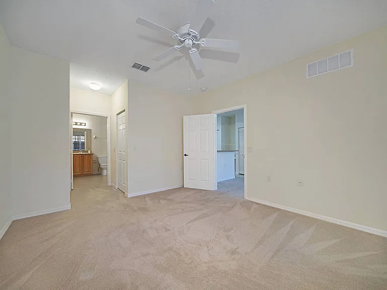 Primary bedroom w/ adjoining bathroom