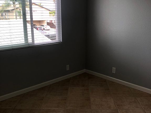 large living room with ceiling fan/light
