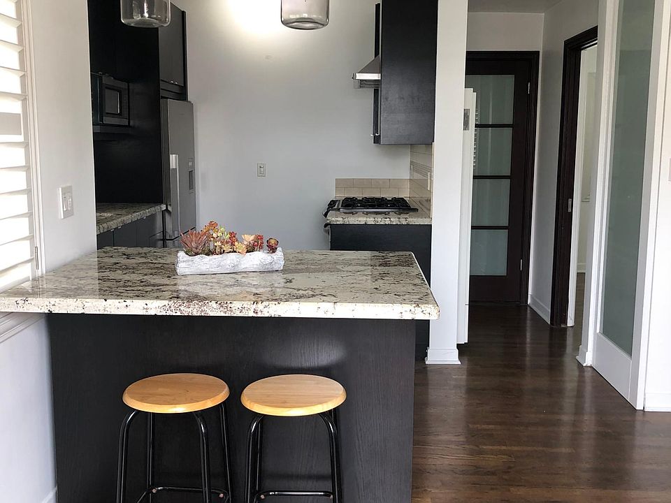 Hardwood floors throughout the house. Island is on wheels and can move to allow for different orientation or to make room for whatever you may need.