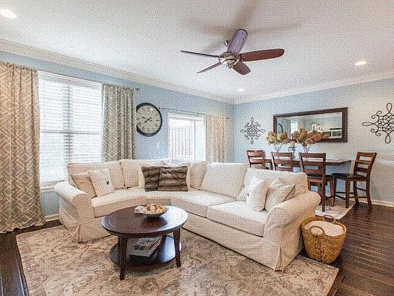 Large open concept family room with hardwood floors