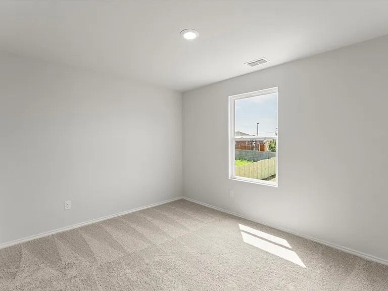 Room featuring light neutral wall paint, recessed ceiling lighting, a single window, and neutral-toned carpet flooring