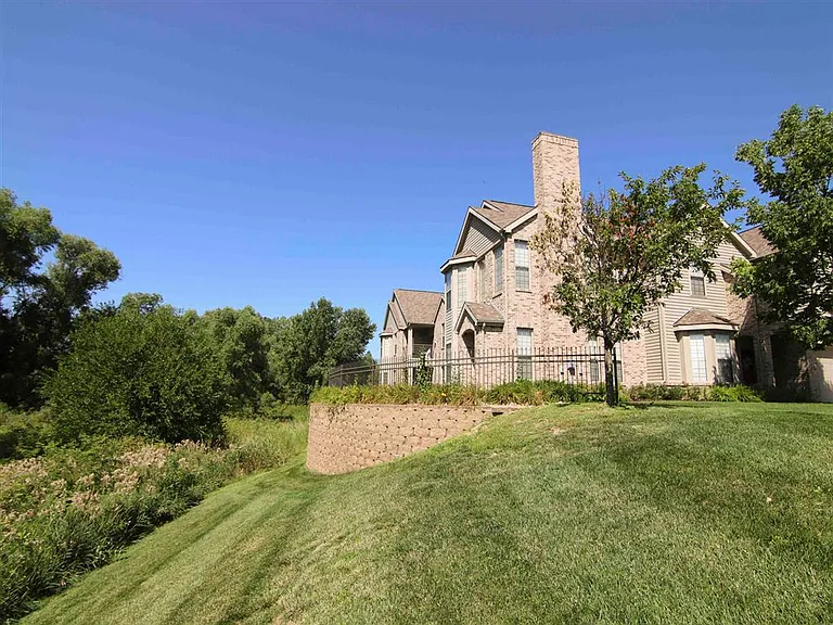Discover serene living with expansive greenspace and trees.