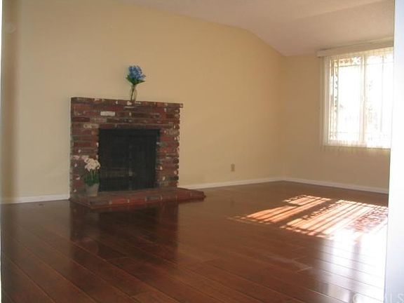 New floors in living room with gas-assist fireplace