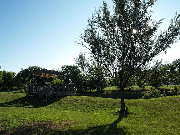 the deck by the pond waits for you