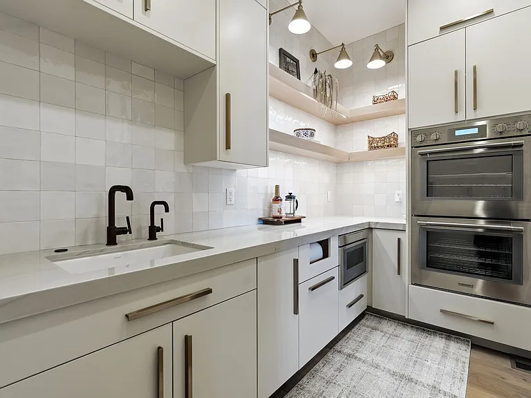 Butler's Pantry with double ovens, microwave, ice machine, and reverse osmosis water
