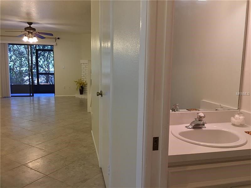 Downstairs half bath and large storage room to the right off the front door.