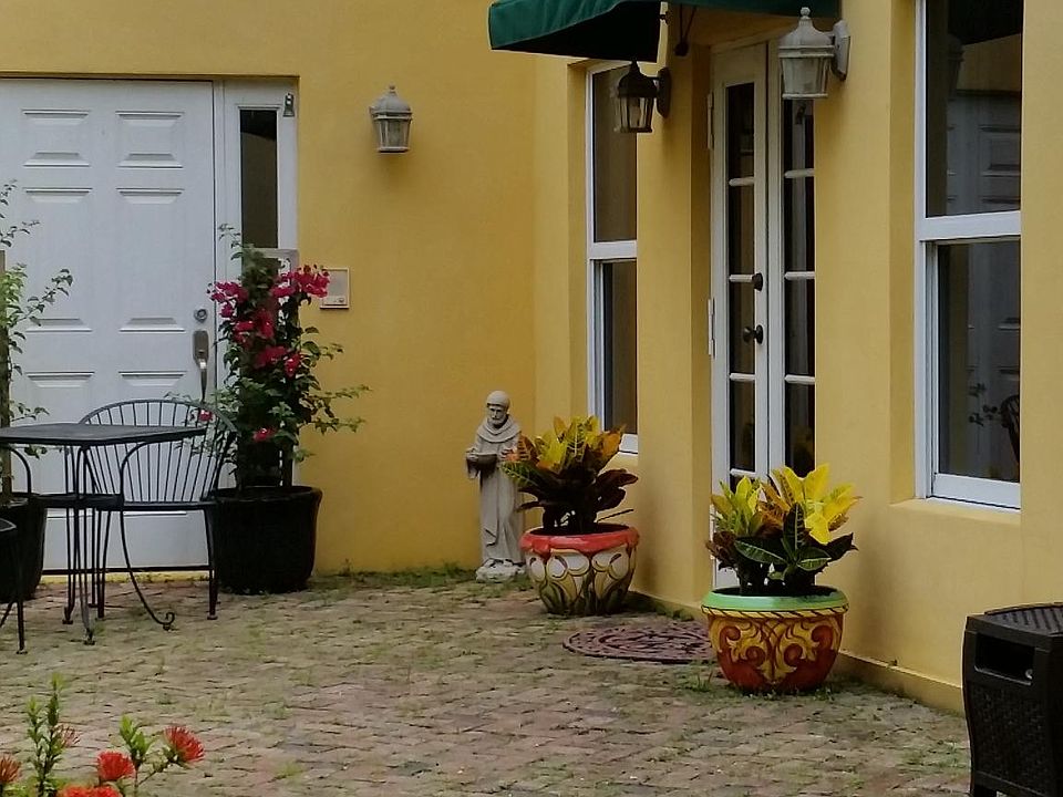 Enter through private brick courtyard.