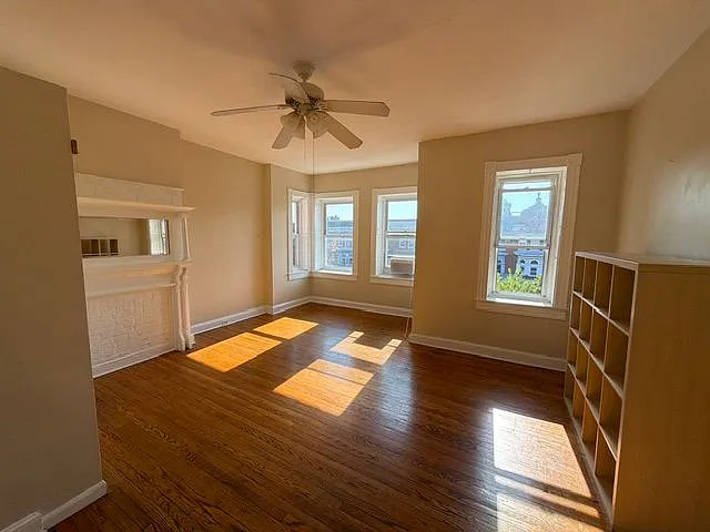 Unfurnished Front Room w/ Western Exposure - Bookcase remains 2/3