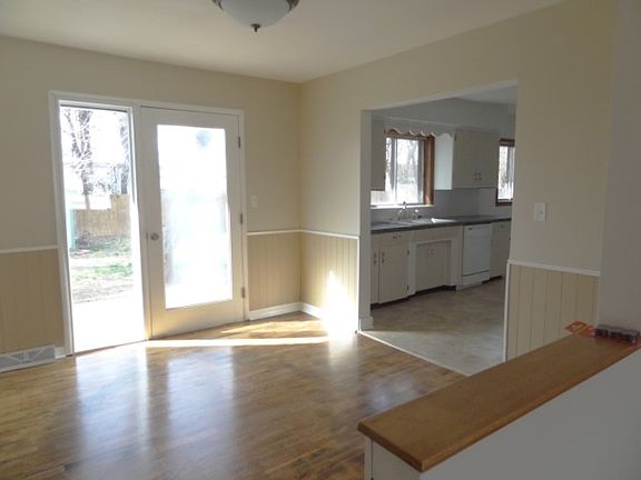 Diningroom with Patio Doors to Fenced Back Yard with Shed
