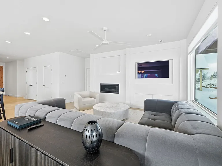 Living room with gas fireplace and smart tv