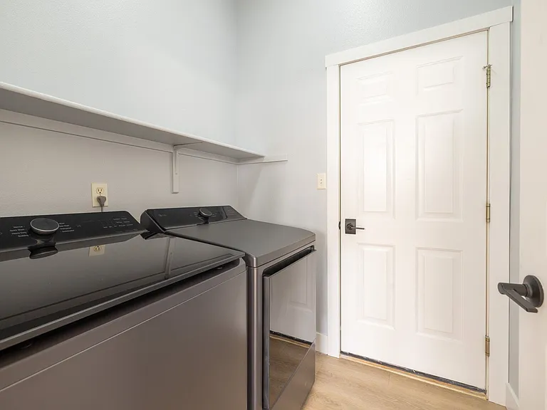 Brand new washer and dryer, door leads to garage