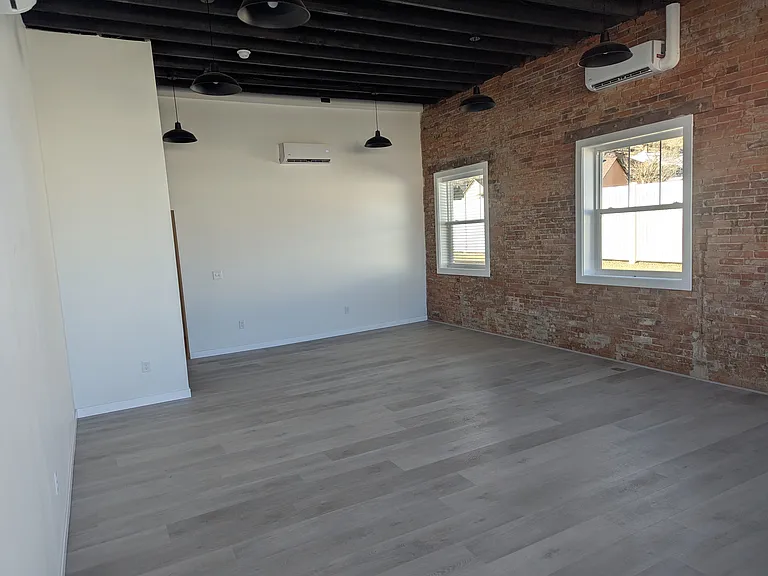 Exposed brick walls and north-facing windows