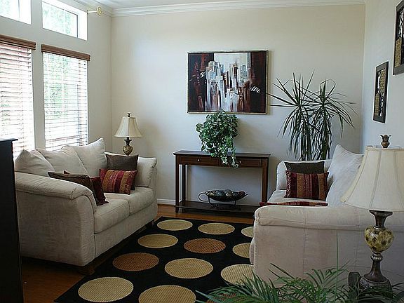 Formal living room with wood floors, great light! Also could be study.