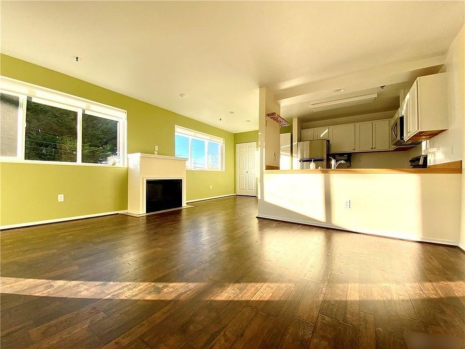 View of kitchen, dining area and gas fireplace. Note: gas fireplace will heat the apartment.