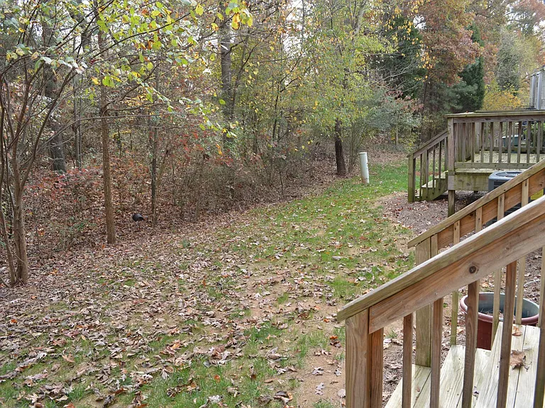 This off the back deck. The back deck is off of the kitchen and it's a great place for a cook out or a friendly game of corn hull. It's quiet and private.