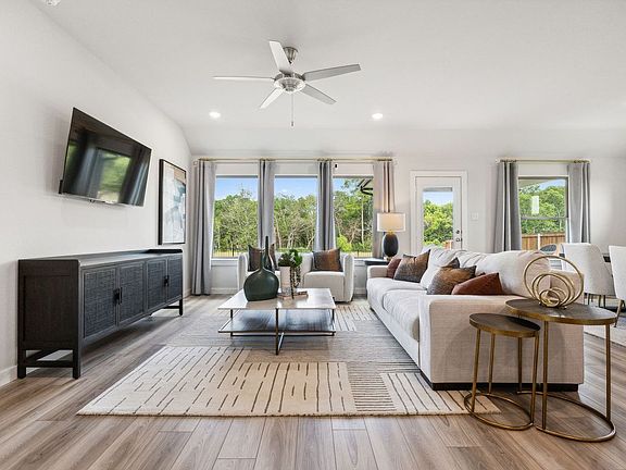 Living Room in the Emmy II home plan by Trophy Signature Homes - REPRESENTATIVE PHOTO
