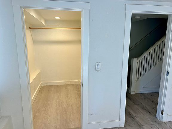 Walk in closet (left) and hall to leading to bathroom