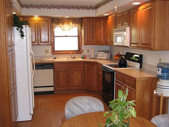 Kitchen-new laminate floor & custom cabinets