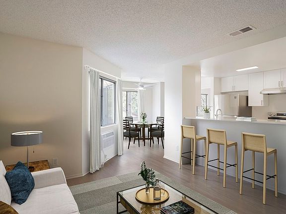 Renovated Package I living and dining room with hard surface flooring