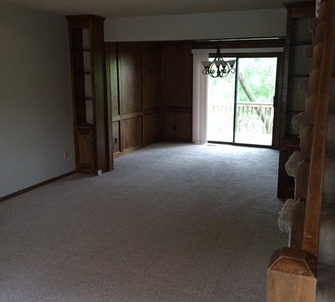 view from front door. Living room and dining room.