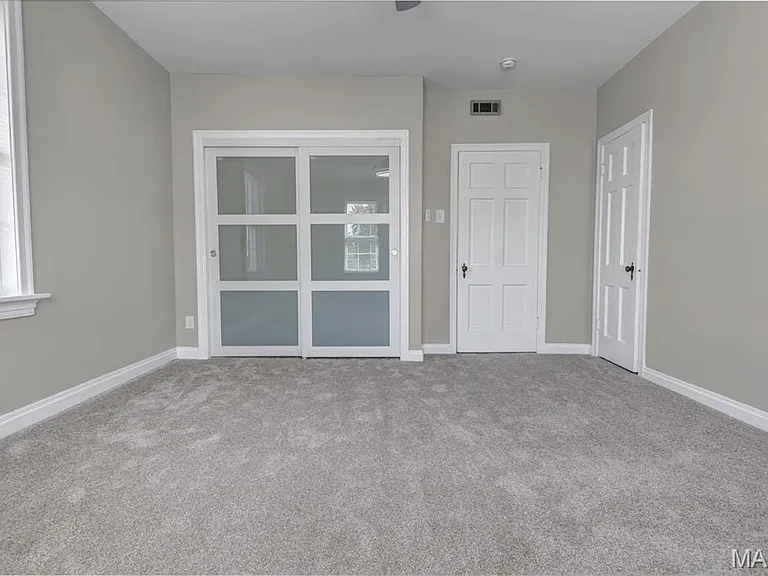 Lighted custom closets in both bedrooms.