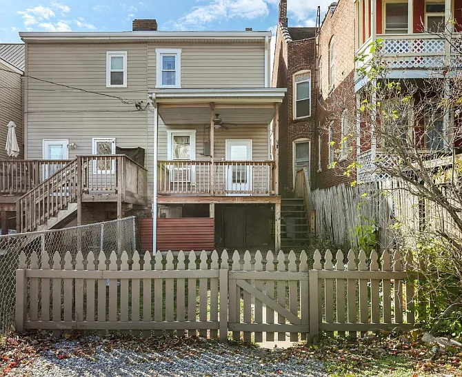 Picture of the back of the house - outside of the fence, there are 2 parking spaces.