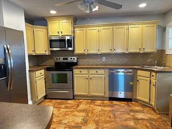 Open Kitchen w/ S/S appliances.